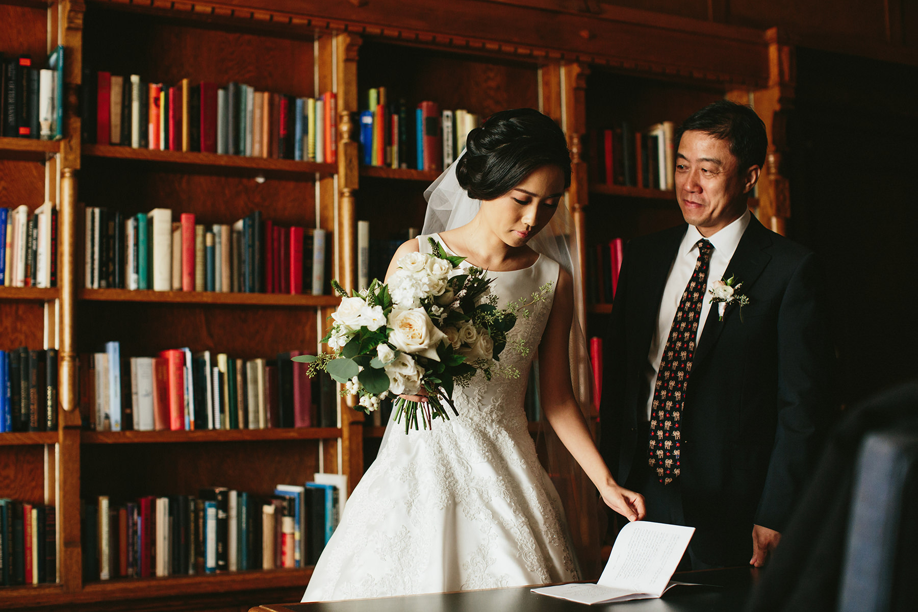 father of the bride in the Cecil Green Park House library www.lucida-photography.com