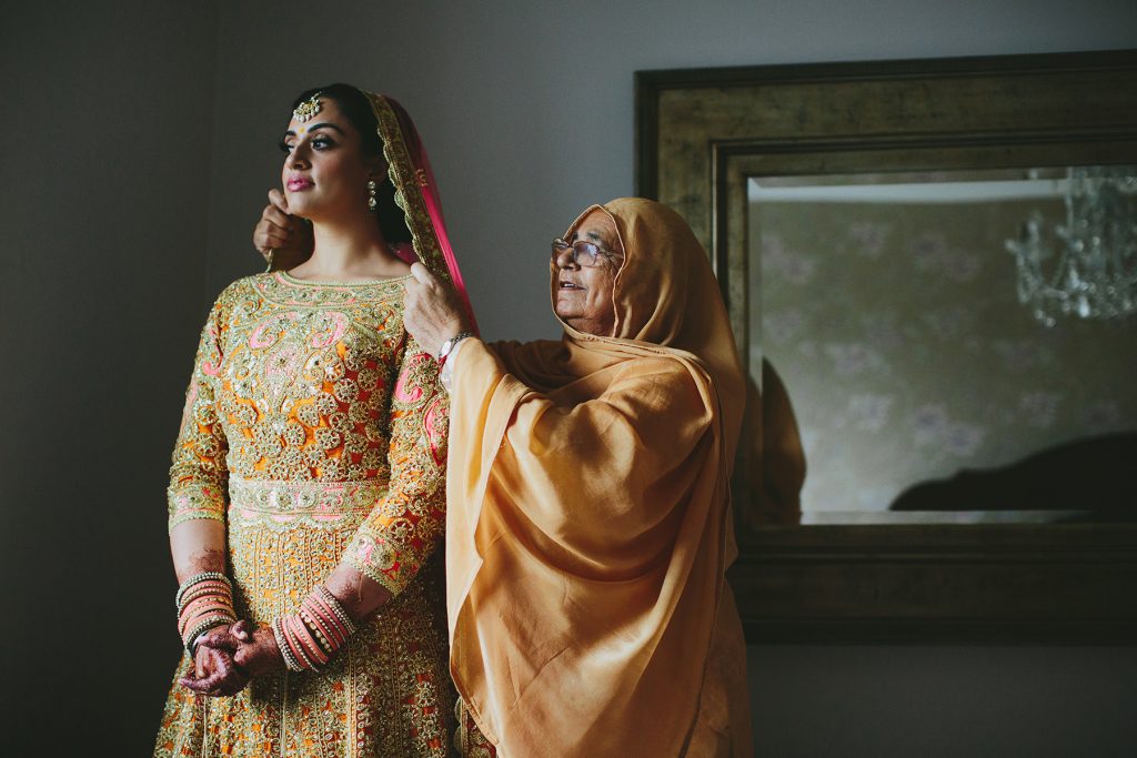 Vancouver Indian bride wears pink gold and orange wedding #lengha www.lucida-photography.com
