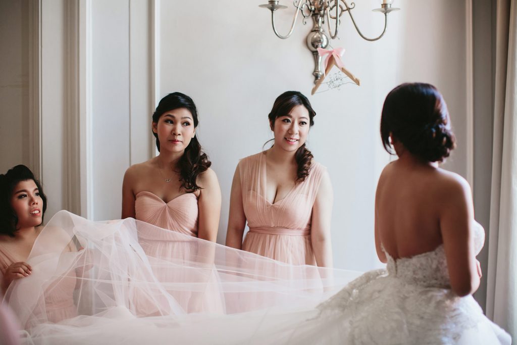 bride gets dressed with her bridesmaids in the georgian room of the vancouver club www.lucida-photography.com