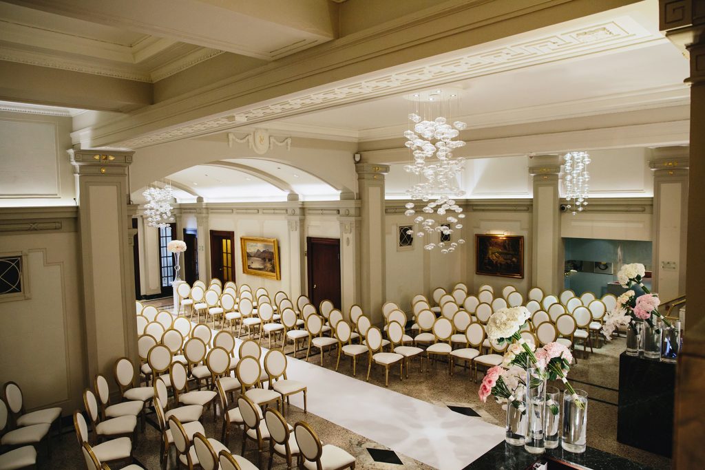 Vancouver Club lobby with decor for wedding ceremony with gold XVI louis chairs and pink and ivory florals photographed by www.lucida-photography.com
