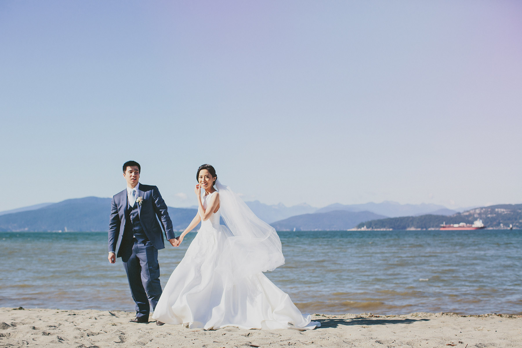 bride and groom on Jericho beach in Vancouver www.lucida-photography.com