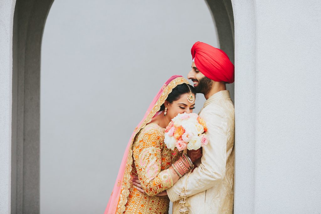 Indian bride and groom laughing at Akali Singh Sikh Society wedding www.lucida-photography.com