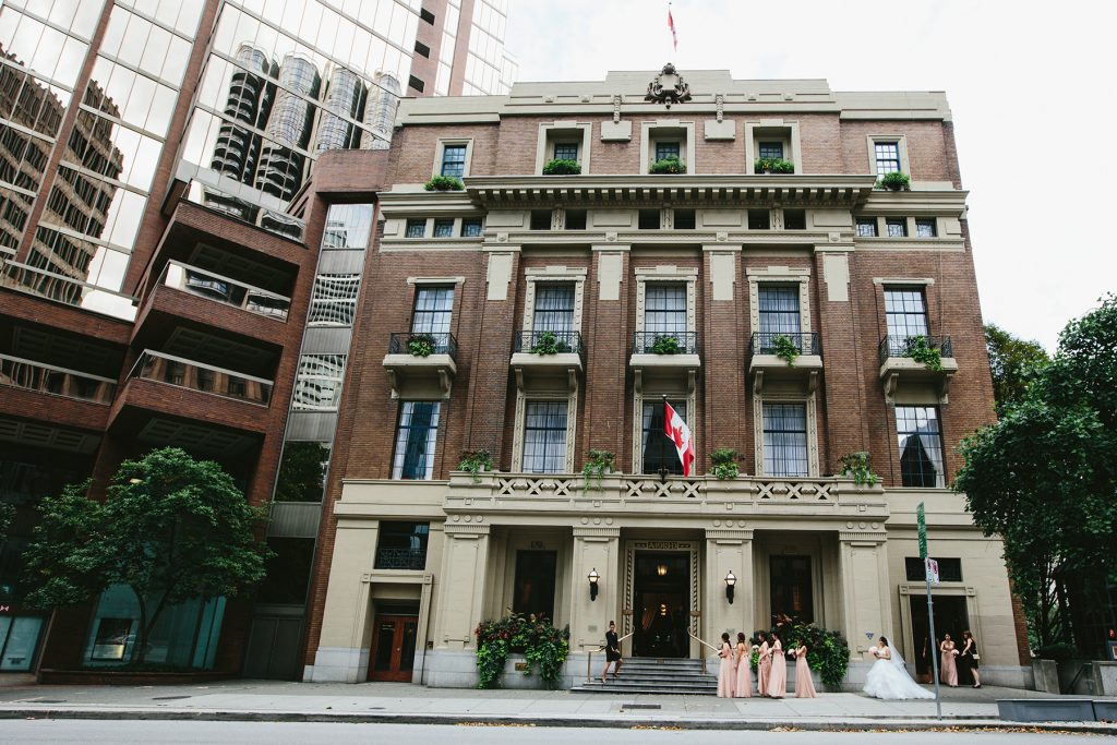 bride walks in front of vancouver club facade before her wedding www.lucida-photography.com