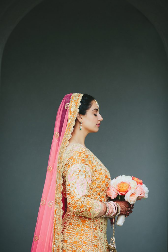 pink and orange lehenga on Vancouver bride www.lucida-photography.com