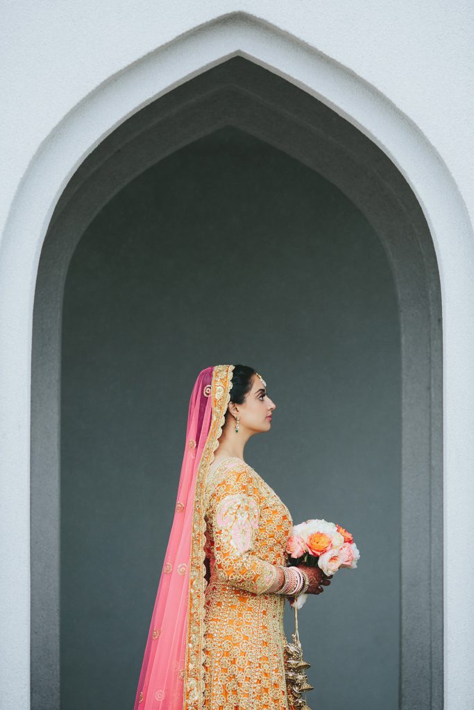 Pink gold and orange lengha on Vancouver Indian bride www.lucida-photography.com