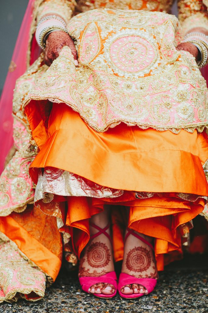 modern wedding lehenga in orange gold and pink www.lucida-photography.com