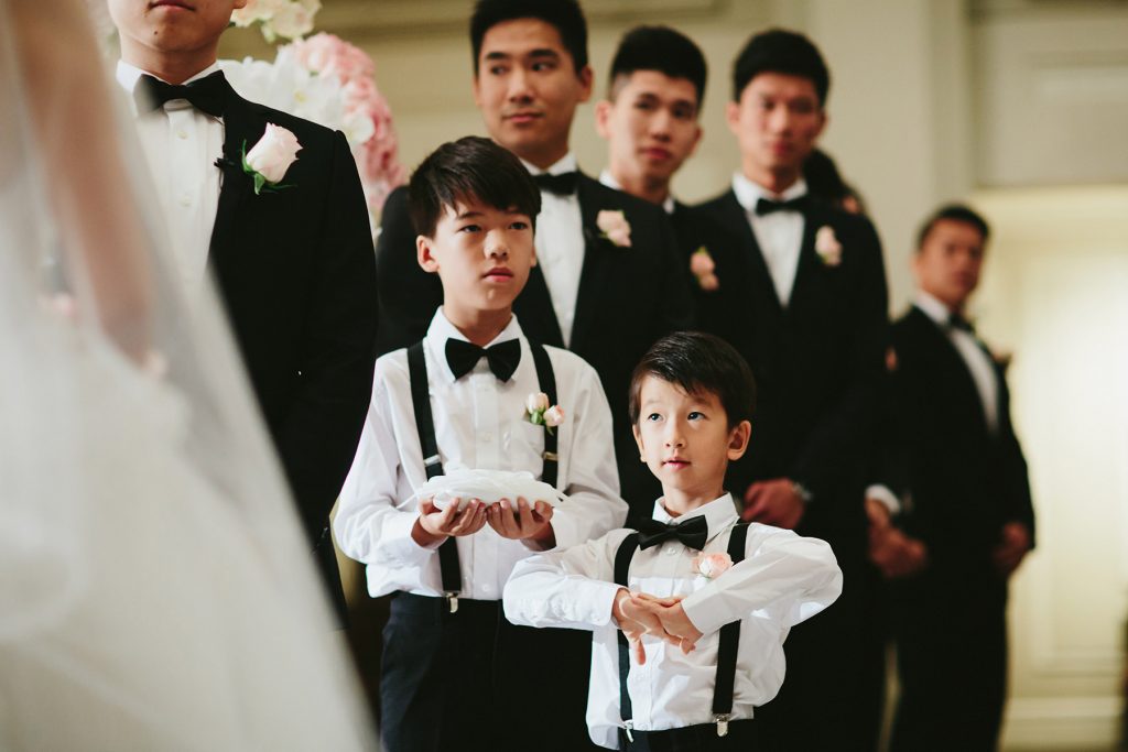 ring bearers at wedding ceremony in lobby of vancouver club www.lucida-photography.com