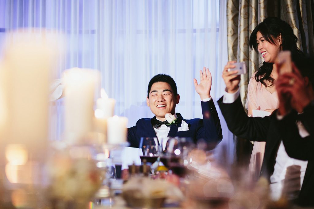 groom reacts to brides serenade at their vancouver club reception www.lucida-photography.com