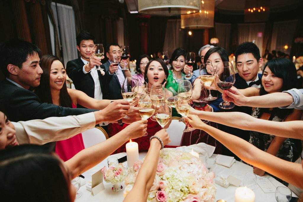 a bride and groom toast tables at their vancouver club reception www.lucida-photography.com